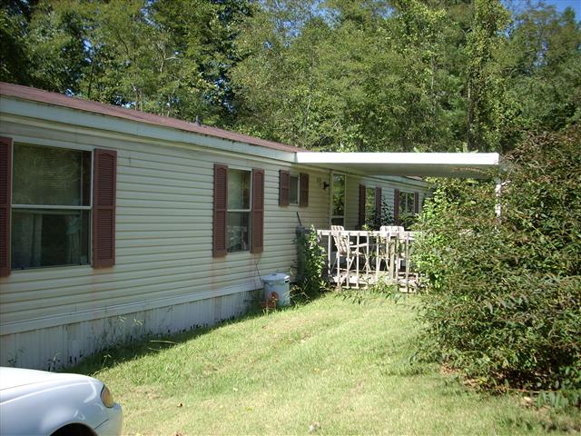A picture of the property located at 115 BLUE WHEELBARROW FARM RD, CANDLER NC 28715.
